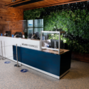 a reception desk with glass cases