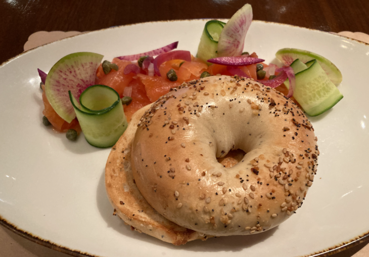 a bagel with vegetables on a plate