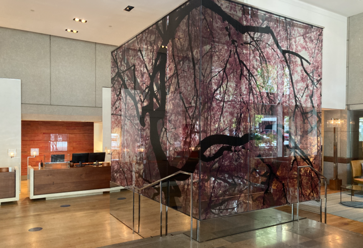 a glass cube with a tree design on it