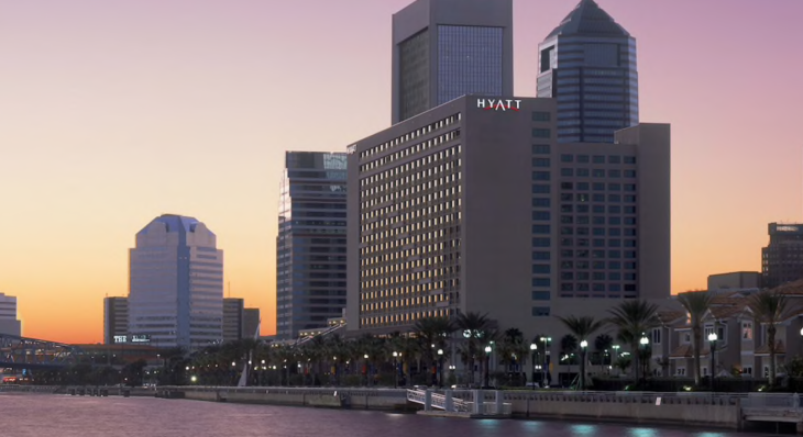 a building next to a body of water