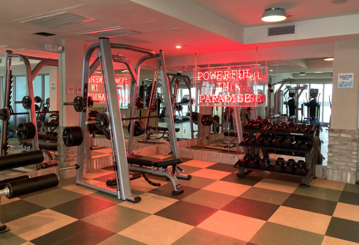 a gym with weights and equipment