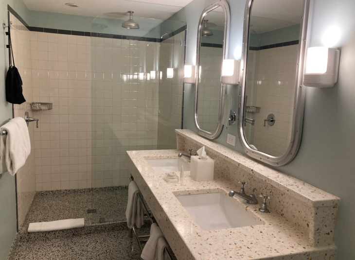 a bathroom with two sinks and mirrors