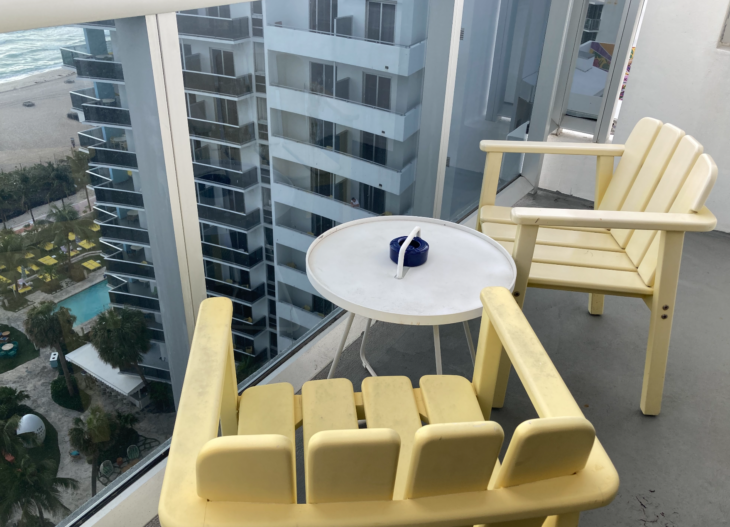 a table and chairs in a balcony
