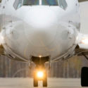 the front of a plane with its landing gear