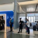 a group of people standing in a line in a building