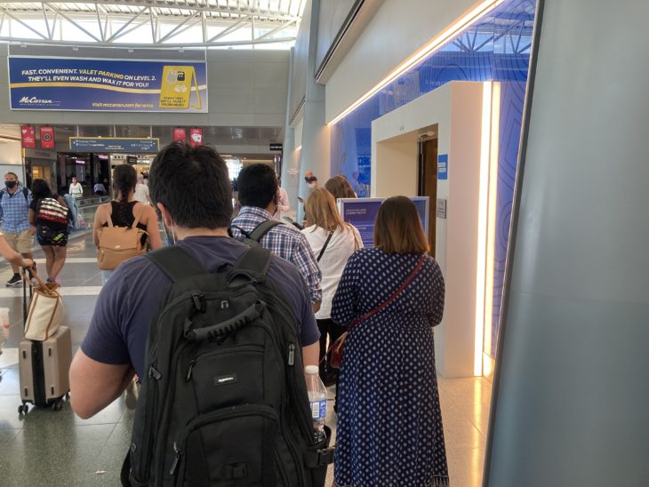 a group of people walking in a building