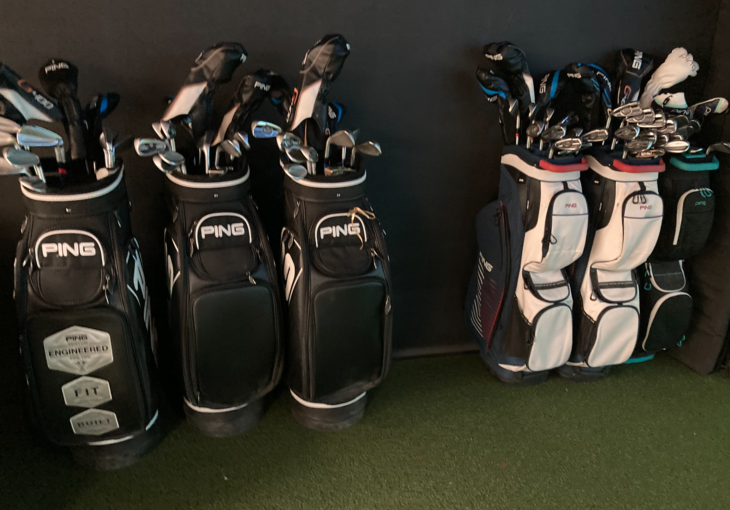 a group of golf clubs in a bag