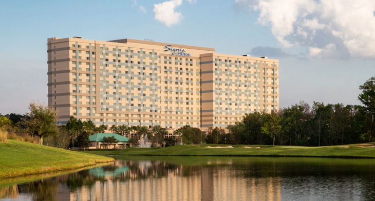 a large building with a body of water