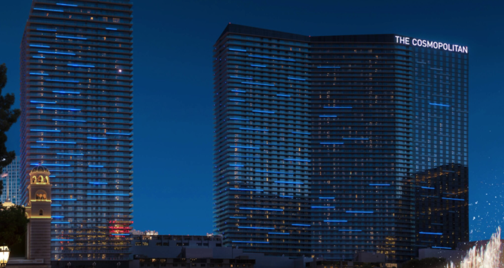 a two tall buildings with blue lights