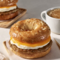 a bagel sandwich with sausage egg and cheese