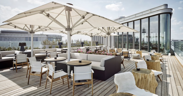 a patio with tables and chairs