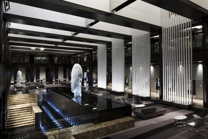 a lobby with a statue in the middle