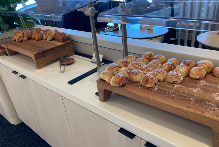 a group of pastries on a wooden board