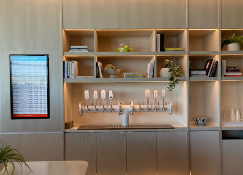 a room with shelves and a beer tap