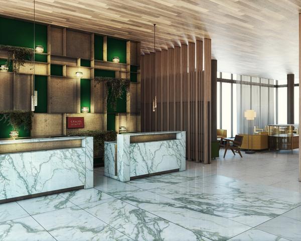 a lobby with marble counter and green walls