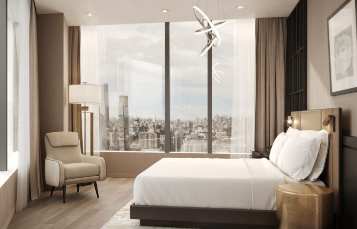 a bedroom with a large window and a large city view