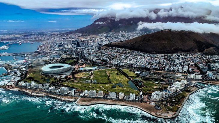 a city with a mountain in the background