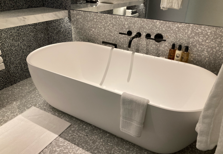 a bathtub and faucet in a bathroom