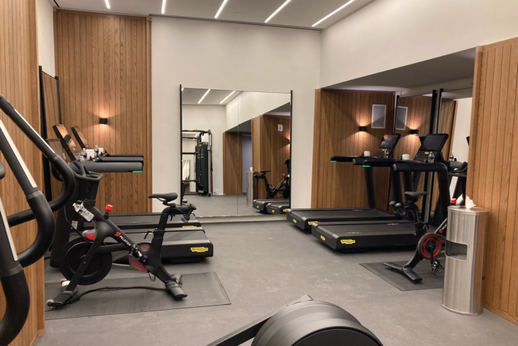 a room with exercise bikes and treadmills