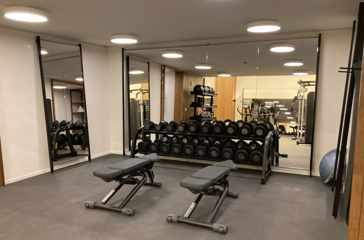 a gym with weights in the front