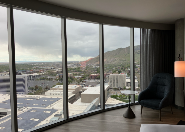 a room with a large window overlooking a city