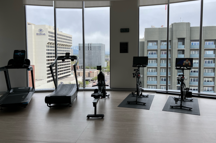 a room with exercise bikes and treadmills