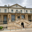 a large building with stairs and a few windows