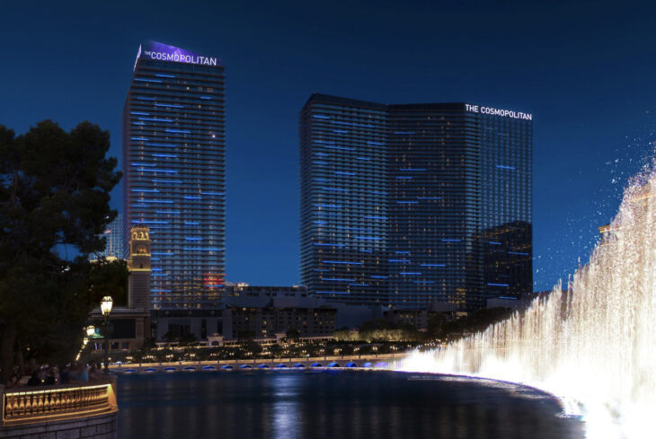 a water fountain with a fountain in front of a city