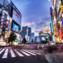 a city street with buildings and lights